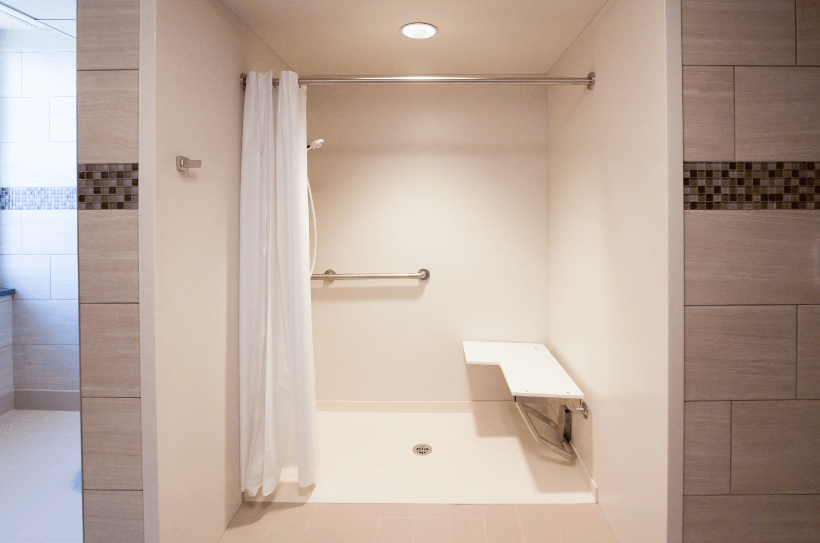 inside bathroom with wheelchair accessible shower 