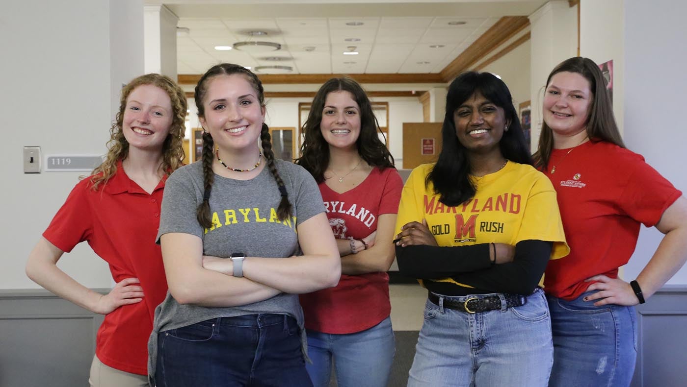 five students wearing maryland gear posing