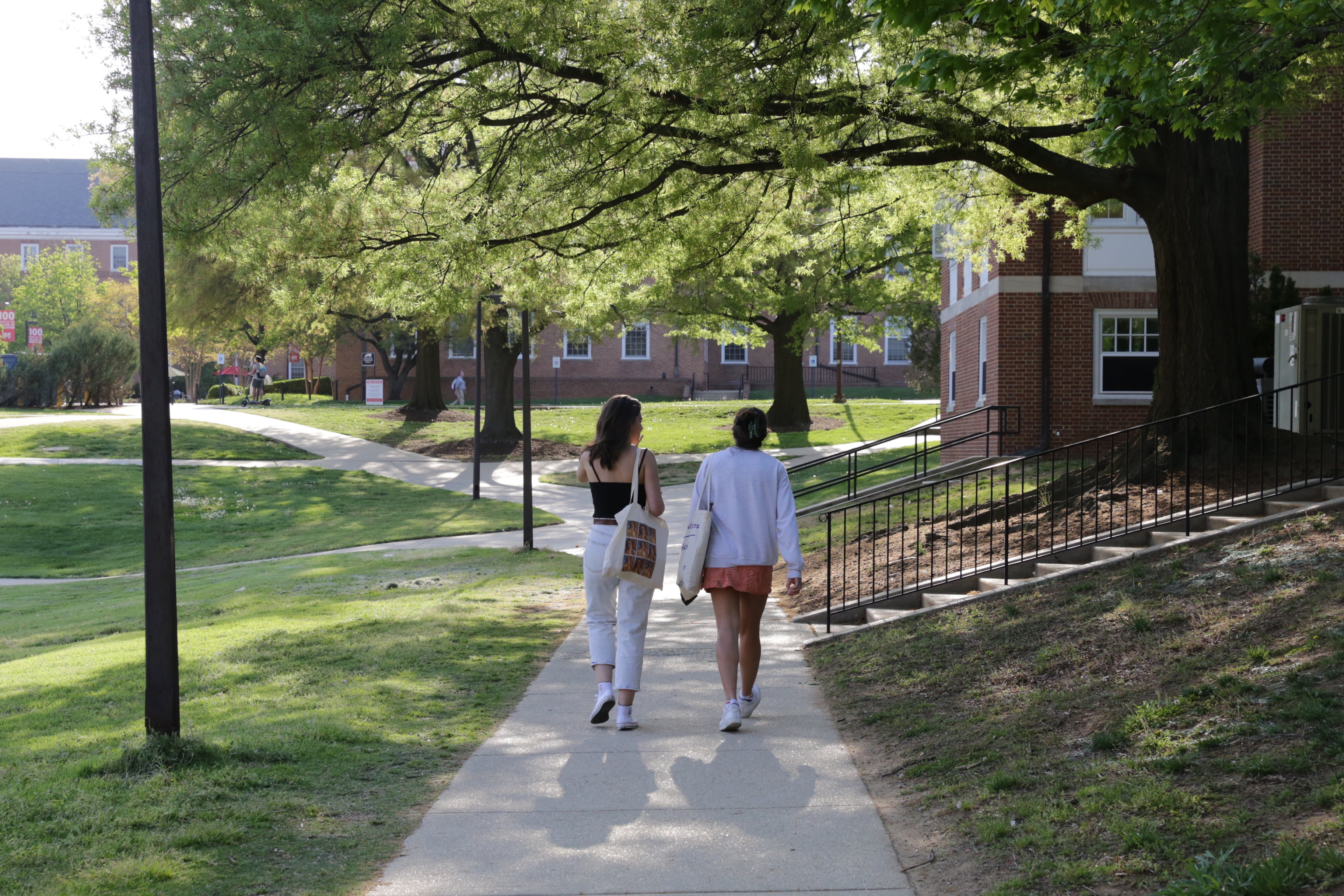 two students walking on campus