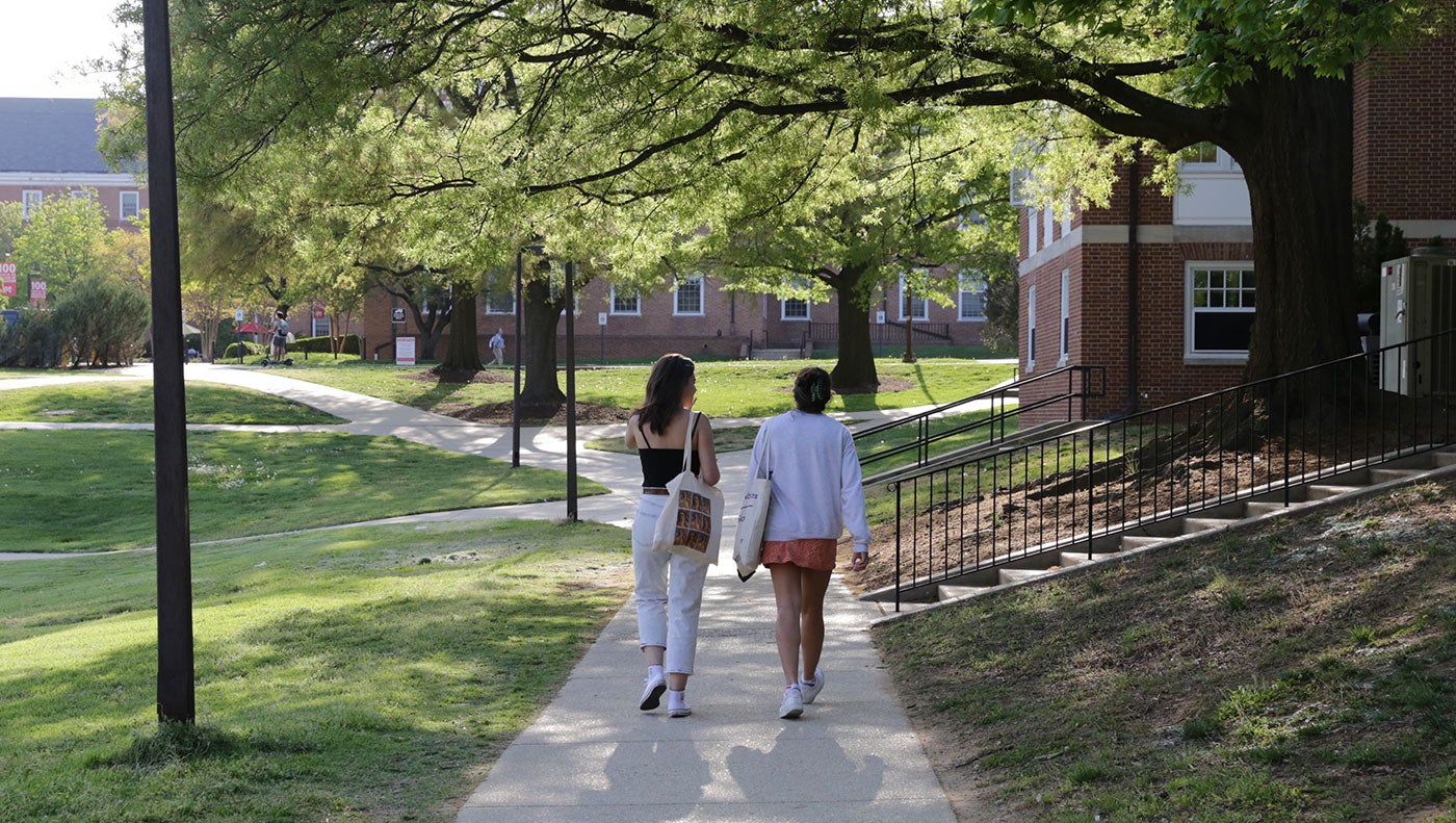 two students walking on campus