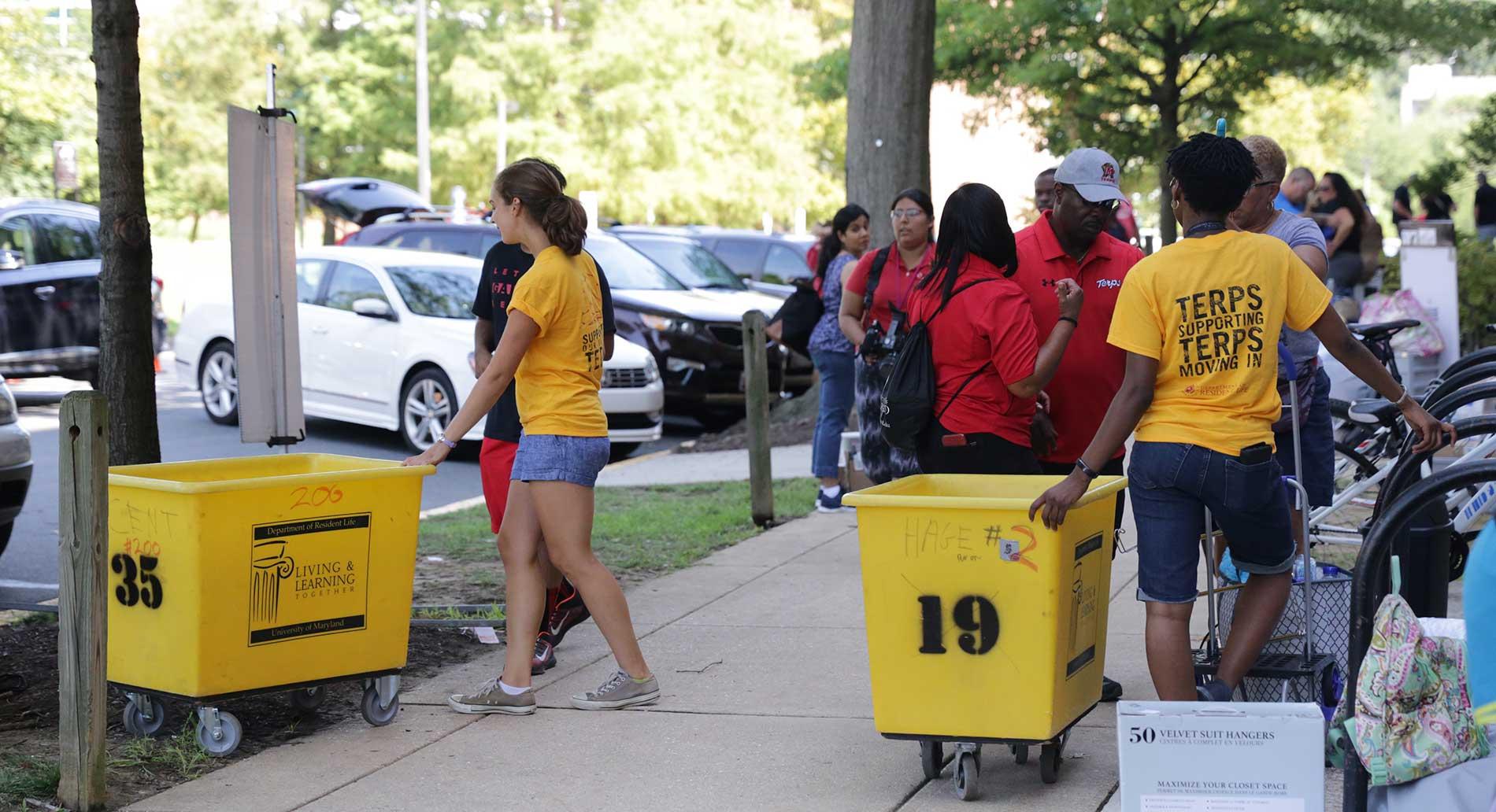 people gathered outside residence hall on move in day