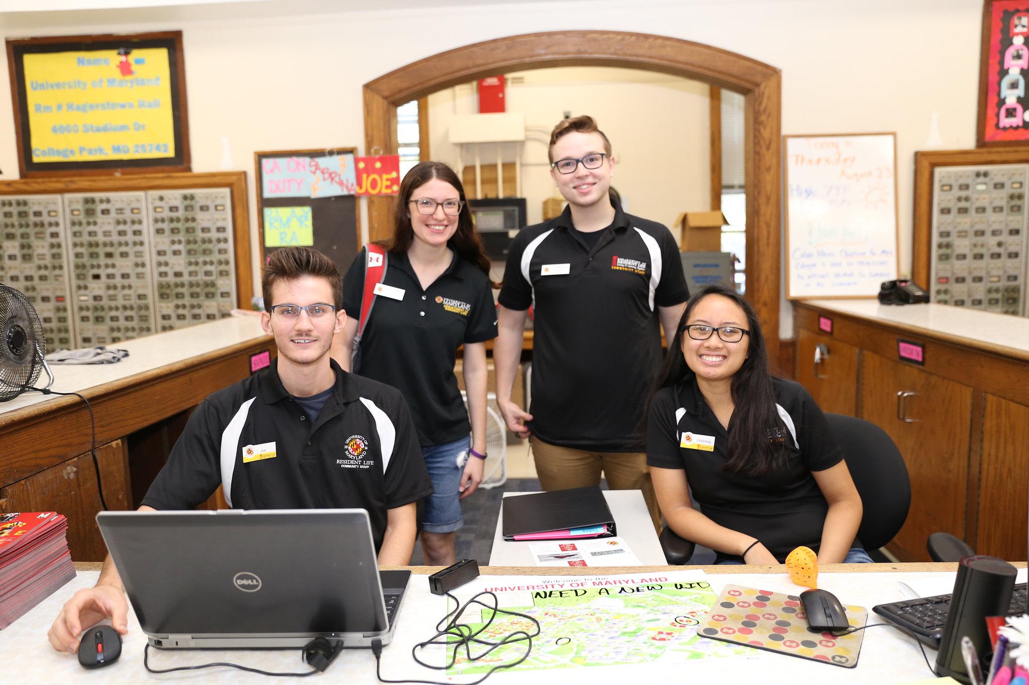 Group of RAs behind front desk