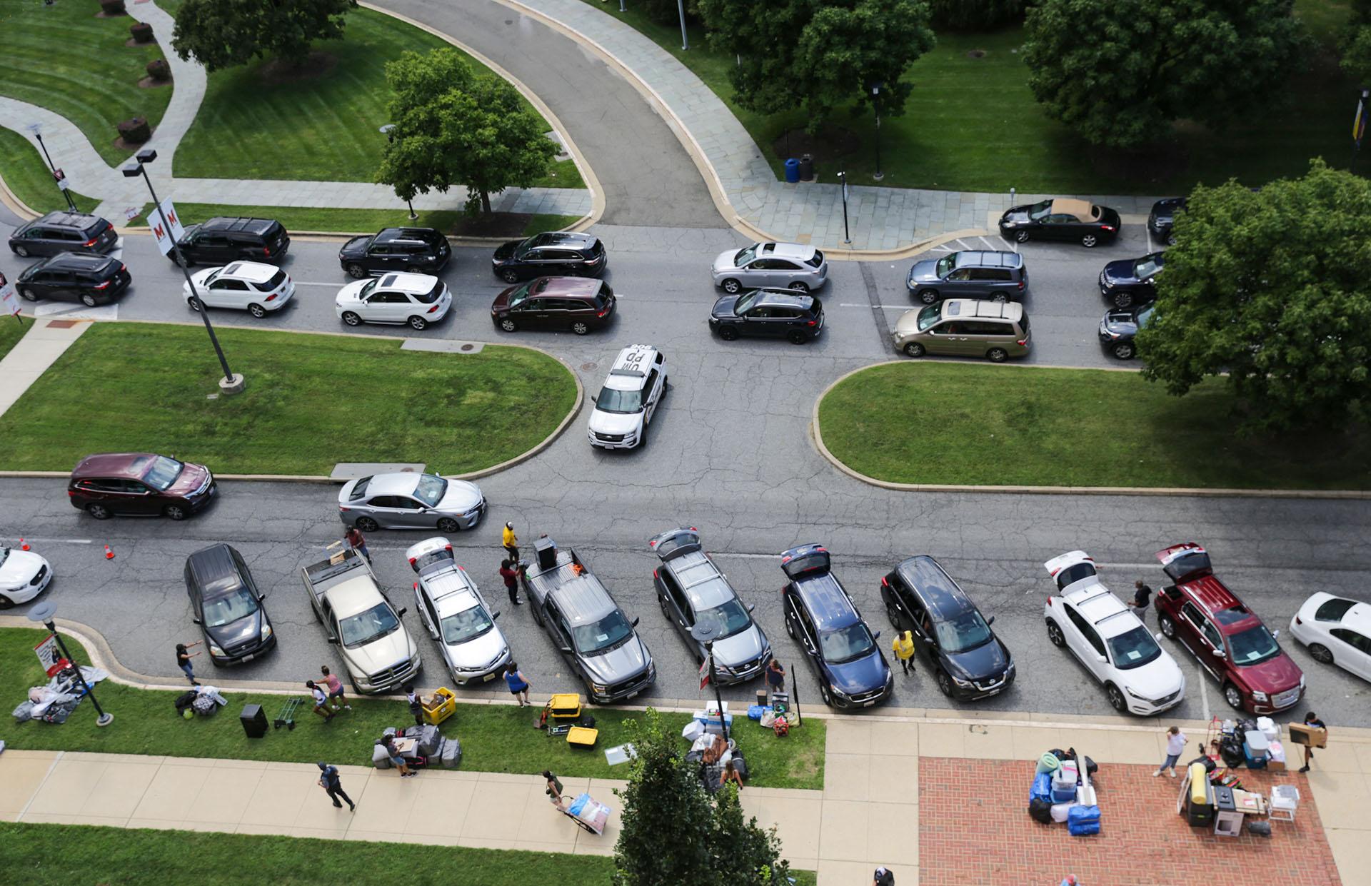 rooftop view of parked cars during move-in