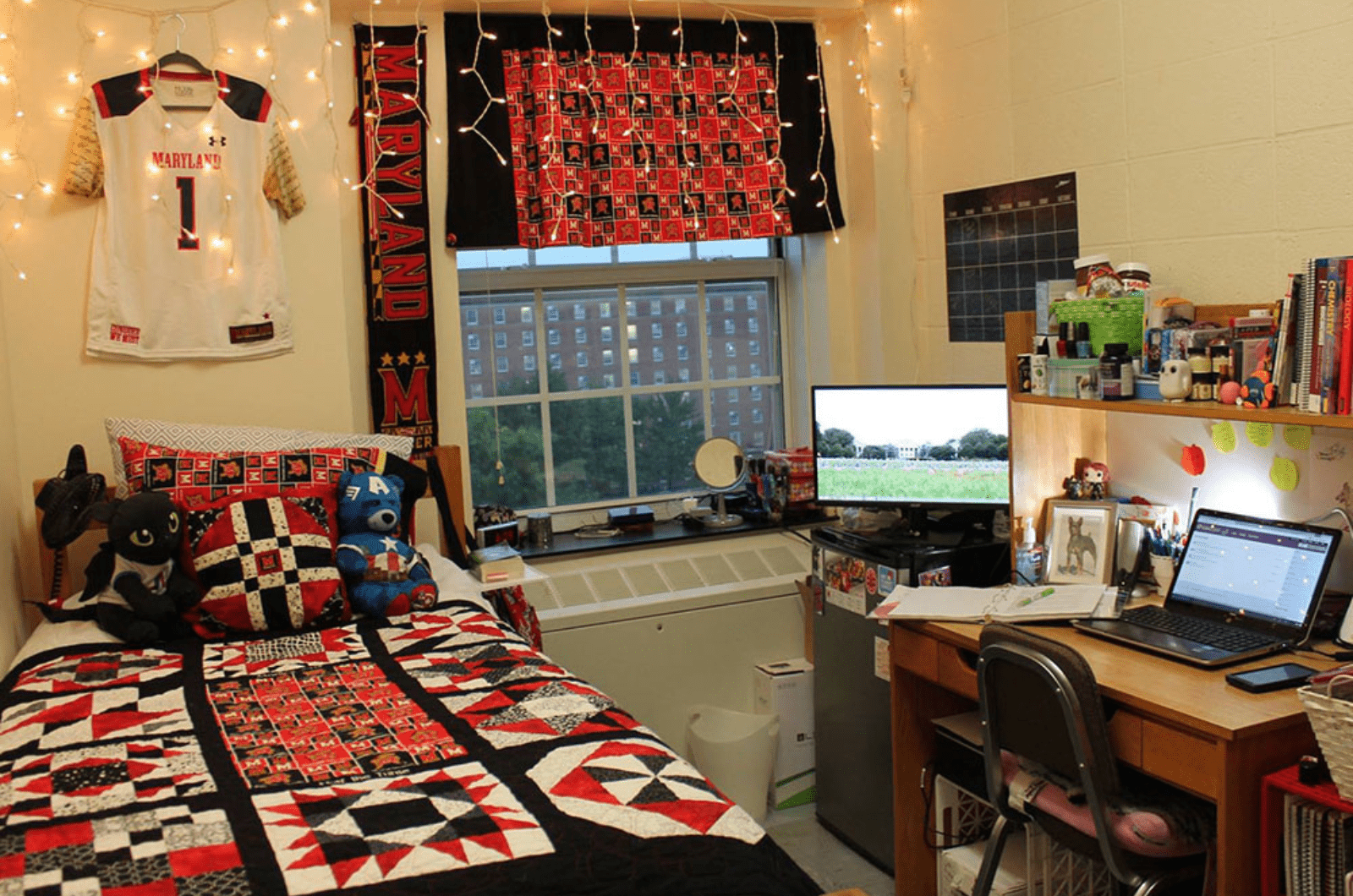 single room with a bed, desk and red decorations