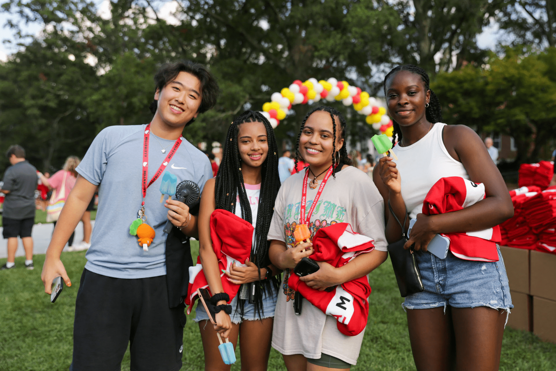 four students at New Student Welcome on McKeldin Mall