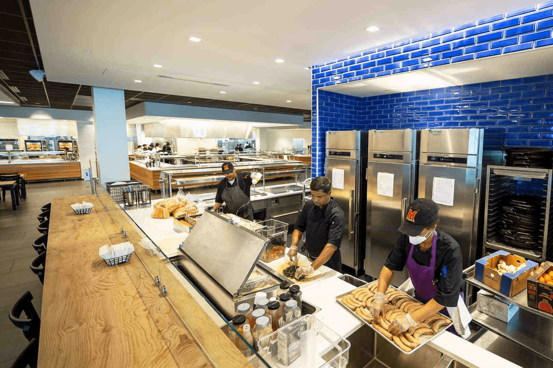 cooks prepping meals in Yahentamitsi dining hall