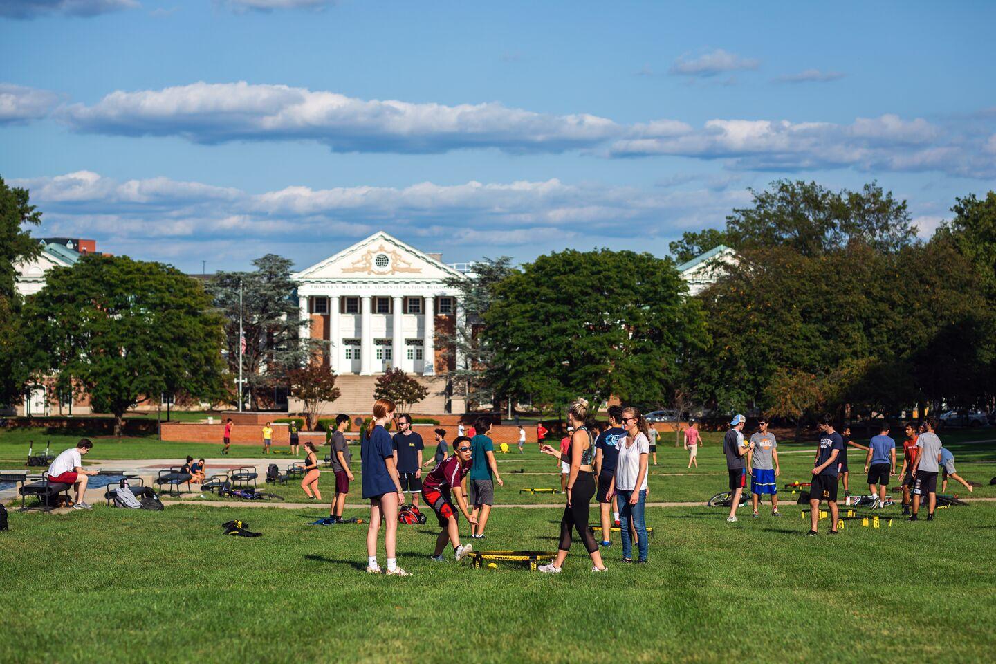 Students playing Spikeball during late afternoon hours on the Mall