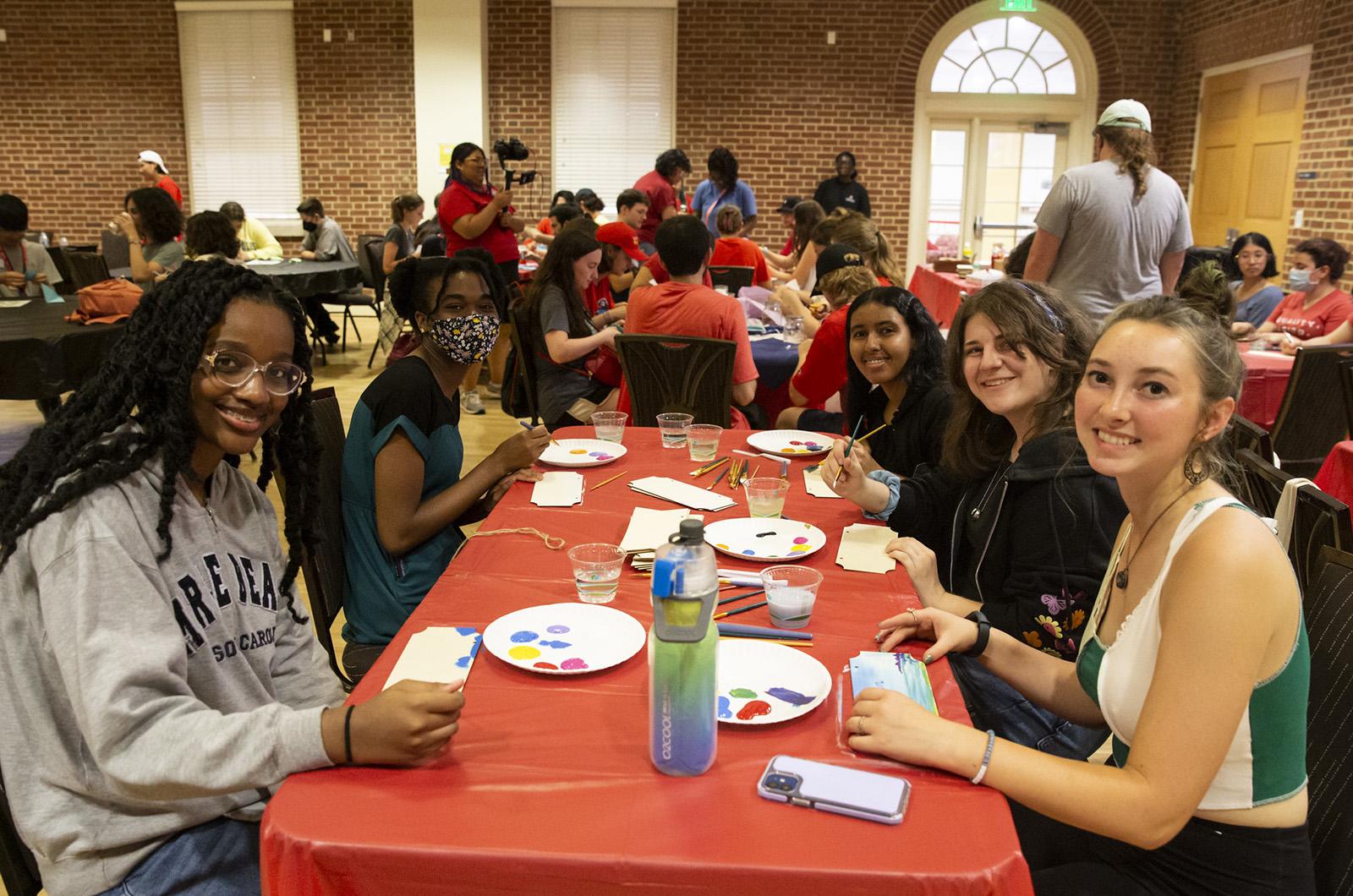 group of students doings arts and crafts at a table during Fall Welcome's Late Night Terp Thing