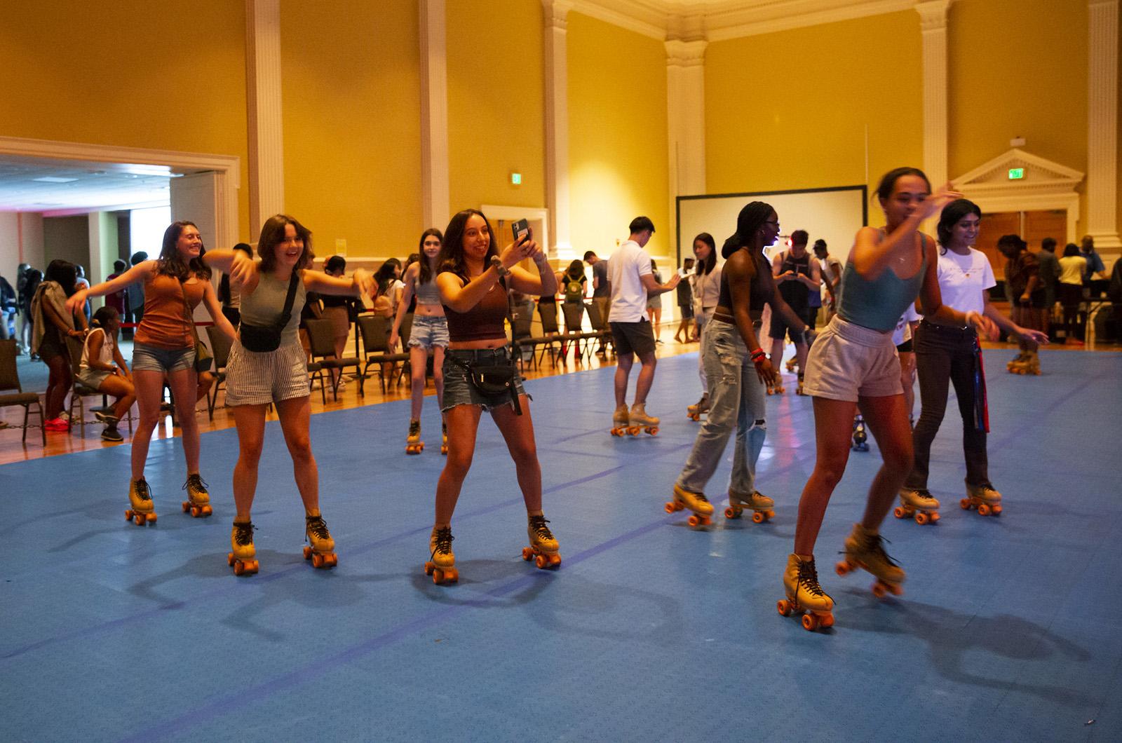 students roller skating during Fall Welcome's Retro RHArcade