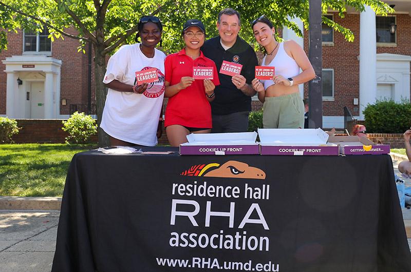 Res Life director with members of RHA at tabling event on Washington Quad