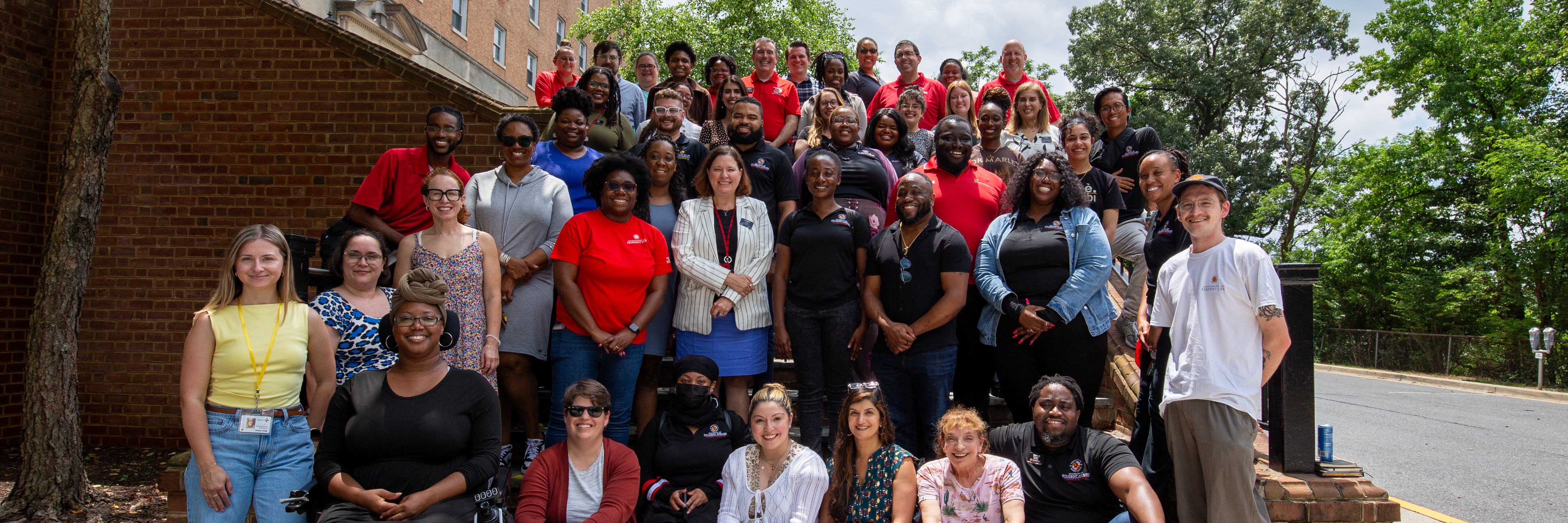 group of about 50 resident life staff members on the steps outside of Elkton Hall