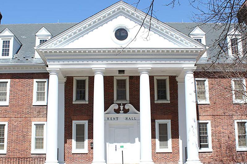 Exterior of Kent Hall, a brick building with four large white pillars and a triangular pediment.